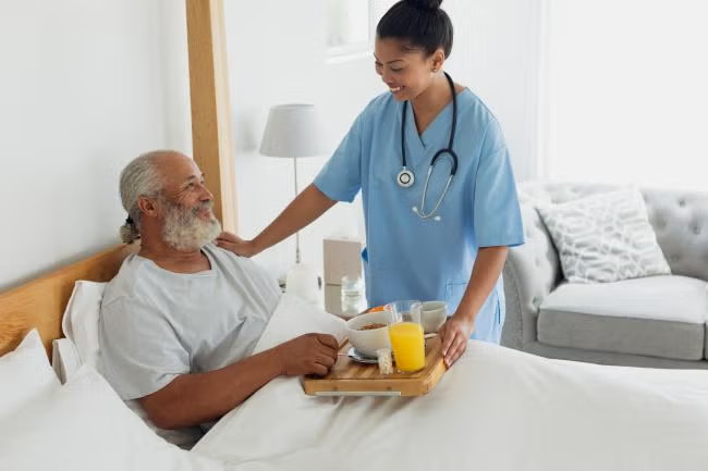 Bedside nurse helping patient